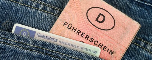 The old and new driving licence are in the pocket of a pair of jeans