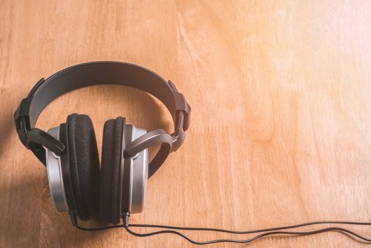  headphones on wooden base