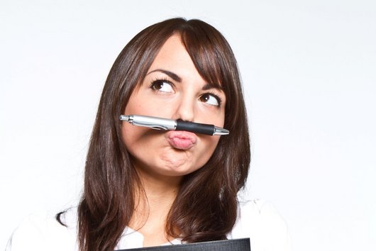 Woman with pencil as moustache and folder in her arms